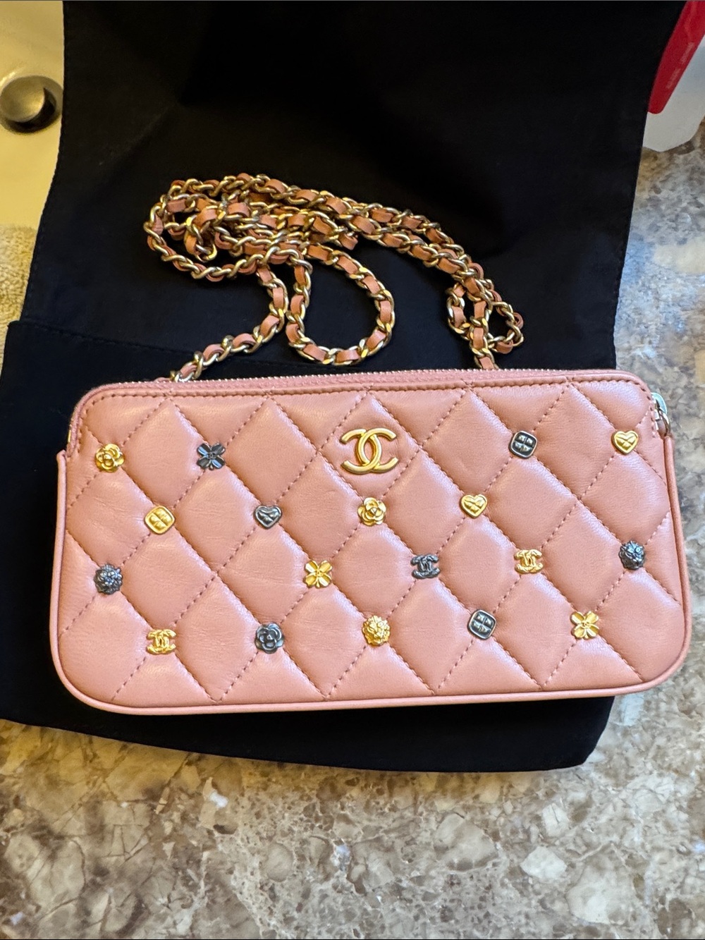 CHANEL Pink Quilted wallet on a chain with Mixed Metal Charms
